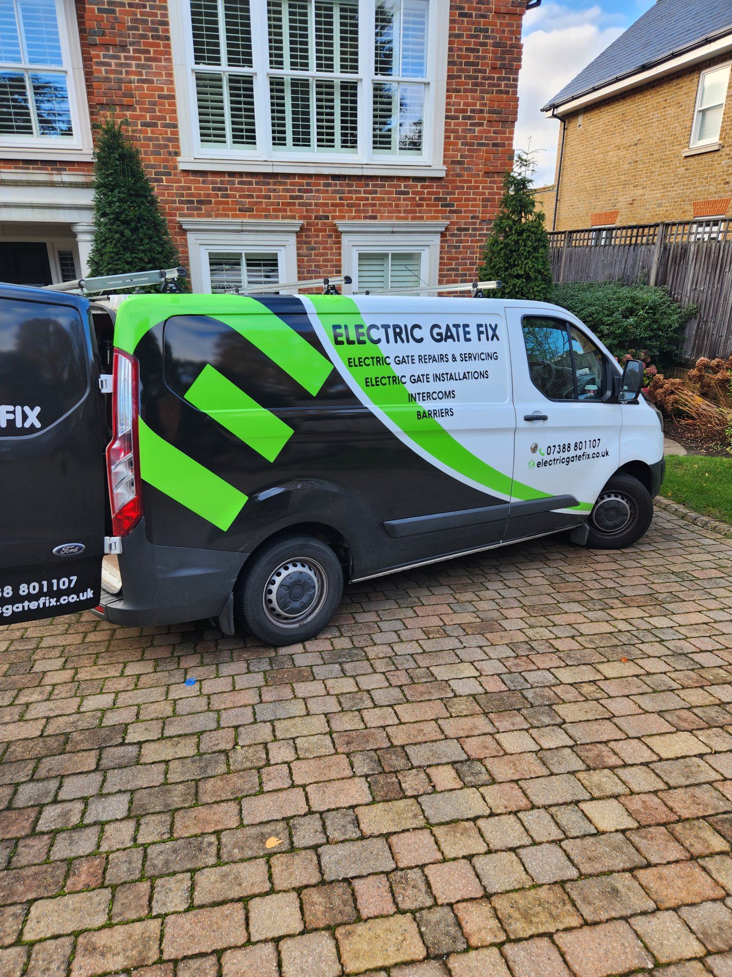 Electric Gate Fix branded van attending a gate repair job at a Surrey residential property